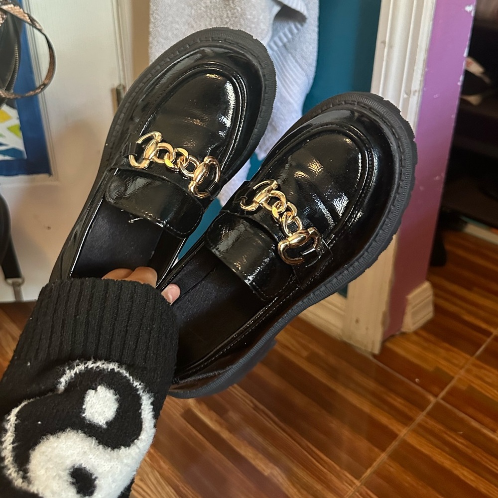 Shiny Black Shoes with Gold Detailing